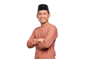 Smiling young Asian Muslim man crossed arms and looking confident isolated on transparent background