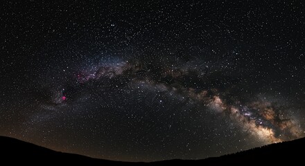 Fototapeta premium Milky Way Galaxy Shining Over Dark Landscape at Night