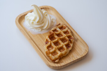 Vanilla Soft Serve Ice Cream with Crispy Waffle on Wooden Tray