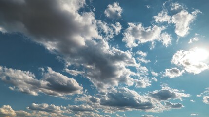 Fototapeta premium Bright and fluffy clouds float in a clear blue sky, creating a serene and peaceful atmosphere for nature lovers.