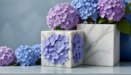 Fototapeta premium A beautiful arrangement of purple and blue hydrangeas showcased in elegant marble vases.