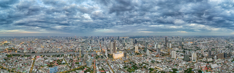 Obraz premium Dark clouds over Bangkok. Aerial panorama of the evening city