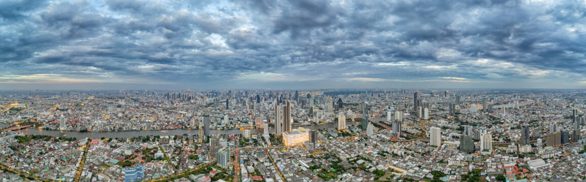 Dark clouds over Bangkok. Aerial panorama of the evening city