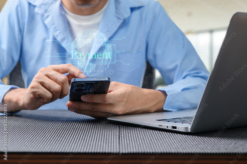 Poster man using smartphone for digital payment with laptop in background