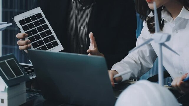 Solar panels green energy Business man working green eco friendly office business creative idea Planing Bio economy for business eco friendly professional Engineer sustainable electricity.