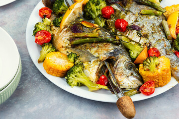 Fried dorado fish, seafood shashlik.