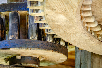 Detailed view of interlocking gears working together in a mechanical system during daylight