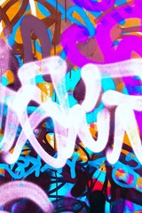 Vibrant graffiti art with bold strokes in neon pink, blue, yellow. Modern 90s urban aesthetic,...