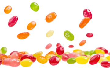 Round jelly candies falling through the air bring joy and sweetness to creative compositions