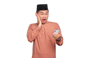 Amazed young Asian Muslim man using a mobile phone, received good news isolated on transparent background