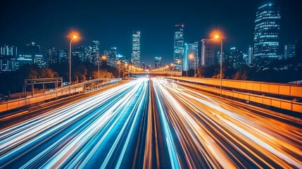 Obraz premium Night city highway with blurred motion light trails. Urban landscape at night with illuminated skyscrapers and a busy highway