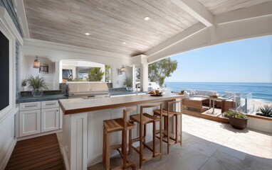 Obraz premium Coastal-inspired outdoor living space with whitewashed cabinetry, teak bar stools, and a built-in grill overlooking beachfront views