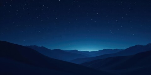 Serene Night Sky Above a Majestic Mountain Range, Silhouetted Against the Deep Blue Twilight