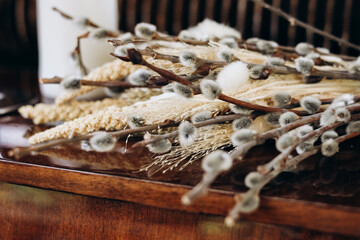 Natural arrangement of dried flowers and twigs on a wooden surface