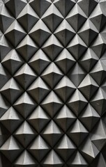 Fototapeta premium A textured wall adorned with an array of shapes and sizes, featuring geometric patterns, organic forms, and vibrant colors that create visual interest.