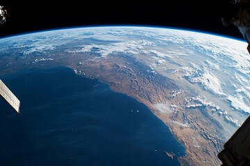 View of Earth from space captured during low-light conditions showcasing urban lights and natural atmosphere
