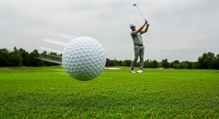 Professional Golfer Mid-Swing with Dynamic Golf Ball Motion on Cloudy Course