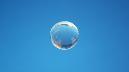 Water-Filled Glass Sphere with Ripples and Air Bubbles