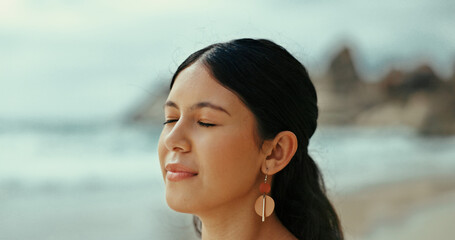 Woman, meditate or peace to relax at sea with fresh air for break, tranquility or natural oxygen. Calm, health or person on holiday at beach or ocean coast for vacation travel and outdoor freedom