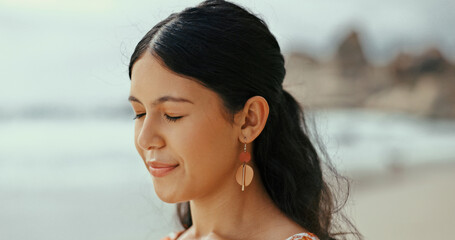 Woman, meditate or breathing to relax with fresh air at beach for break, tranquility or mental health. Calm, peace or person on holiday at sea or ocean coast for vacation travel and outdoor nature