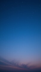 Fototapeta premium Starry Night Sky with Gradient Blue and Subtle Clouds