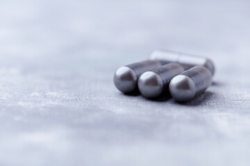 BCAA amino acids tablets. Nutrition for bodybuilding. Fitness supplements on bright background. Soft focus. Copy space.	