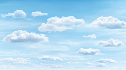 Fototapeta premium A serene blue sky with fluffy white clouds.