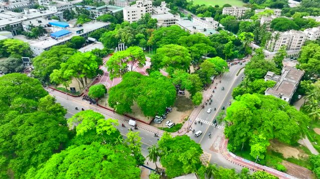 Breathtaking Aerial View of Central Shaheed Minar  Surrounded by Dhaka University Green Trees and Bustling Roads