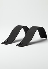 Two Curved Black Holders on White Background