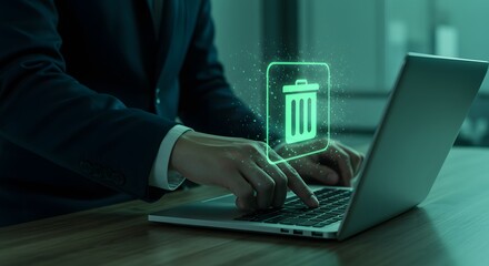 Data Deletion: Business Professional Erasing Files on Laptop, Green Hologram Trash Icon.