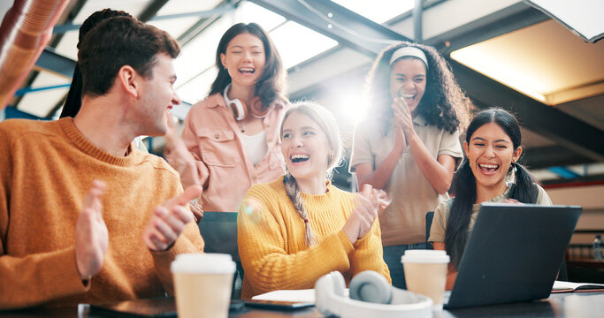 Happy people, team or celebration with applause on laptop for winning, promotion or good news at office. Excited, creative group or designers clapping with technology for project success at workplace