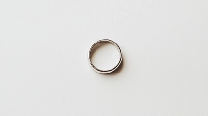 A silver ring on a white background.