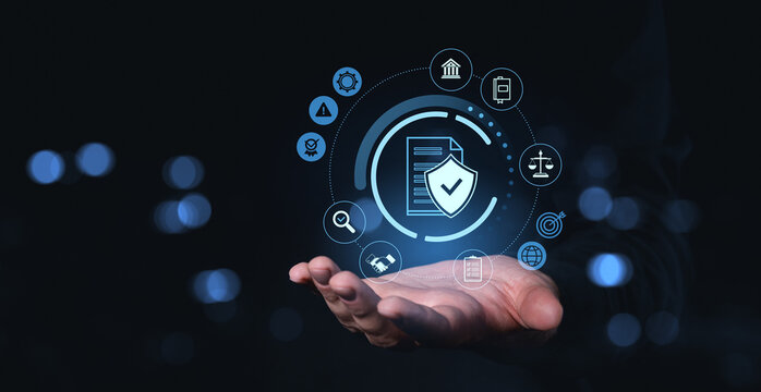Digital data protection icon hovering above hand on dark tech background.
