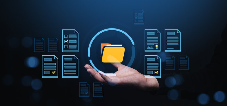 Digital folder and document management concept in hand on dark background interface.