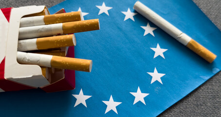 Flag of European Union, cigarettes . Tobacco law. Smoking control in EU countries