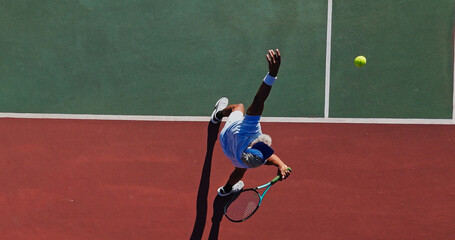 Tennis, serve and mature man on court with challenge, performance and outdoor game from above. Racket, ball and professional athlete at lines for fitness, wellness and competition at sports club