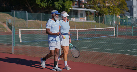 Tennis court, mature couple and interracial people for match, game or competition. Fitness, sports racket and athlete man with woman for training, workout and weekend hobby for health and wellness