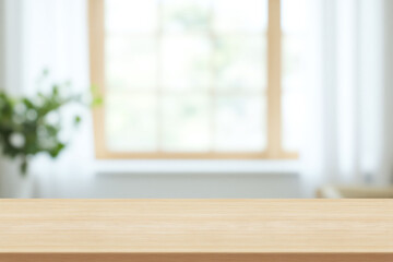 wooden table top with blurred kitchen background