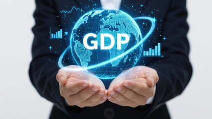A person in a suit holds a holographic globe displaying "GDP," symbolizing global economic growth and financial analysis.