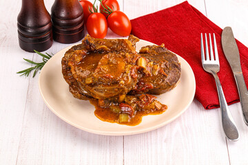 Italian cuisine - ossobuco with sauce