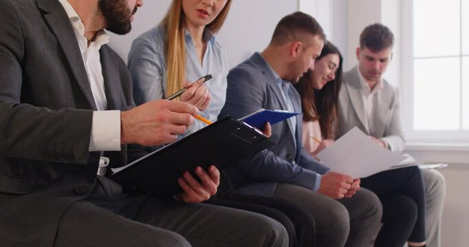 Applicants writing resume papers test, making exam preparations for job interview, result awaiting, feeling worried and stressed, sitting in waiting room, cv qualification candidates career planning