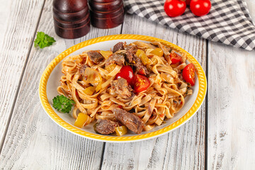 Asian udon noodles with beef