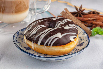 Delicous sweet donut with chocolate glaze