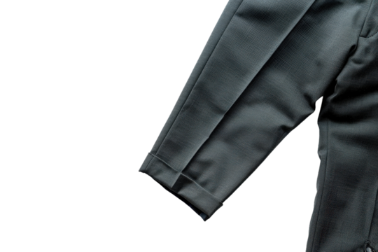 Black formal dress pants neatly folded on plain background