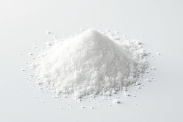 Loose white sugar crystals against pure white backdrop, still life, cuisine