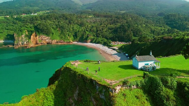 Aerial view of a Ermita de la Regalina on the steep cliffs in Asturias, Spain
