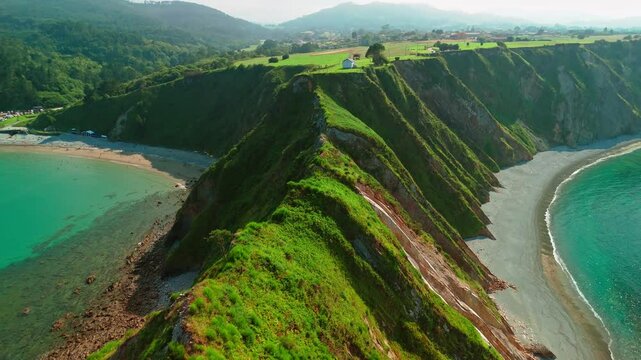 Aerial view of a Ermita de la Regalina on the steep cliffs in Asturias, Spain