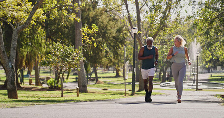 Fitness, elderly couple and running in park for wellness, cardio exercise and training in...