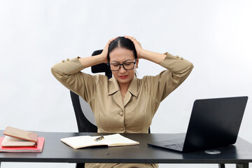 Frustrated asian civil servant female at office. Isolated on white background