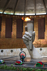 Hall of Military Glory or Pantheon of Glory with hand holding Eternal Flame torch of monument "Heroes of Battle of Stalingrad", Mamayev Kurgan. 80 years of the victory of the USSR in SWW.
